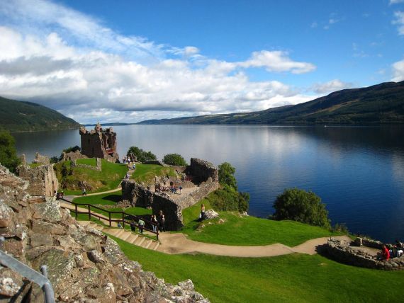 Urquhart Castle stands in a commanding position on a promontory overlooking Loch Ness.